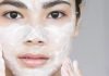 closeup of a young asian female face with facial cleanser applied