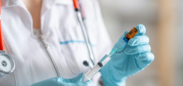 Image of doctor preparing a treatment injection