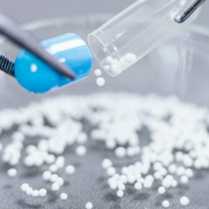 Pharmaceutical Worker Examining a Pill, close-up
