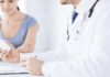 image of concerned female patient consulting with a doctor