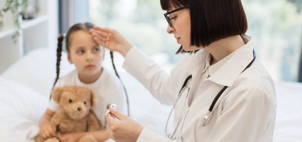 A Pediatric doctor examining a child