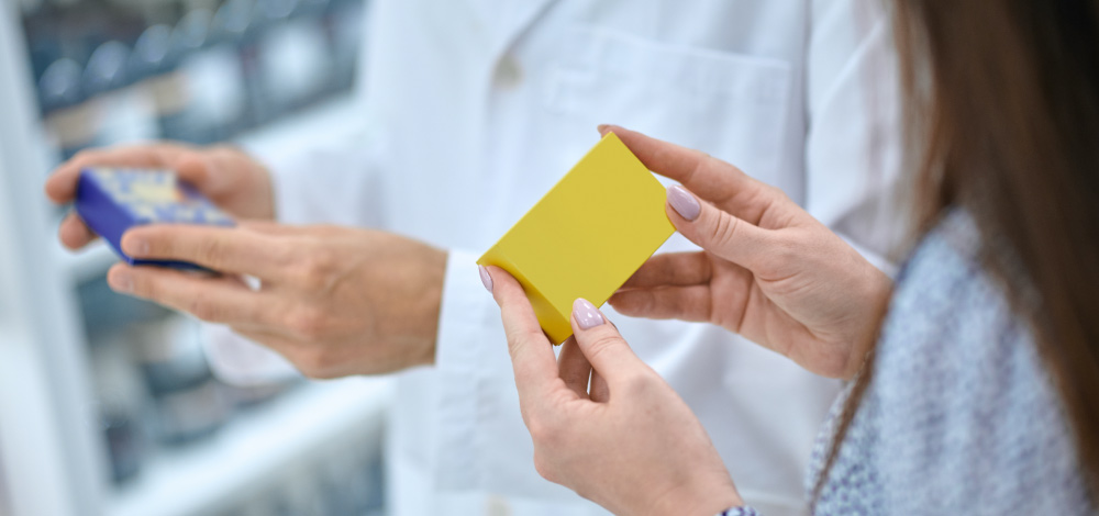patient looking at medication in a pharmacy (presumably for treating shingles)