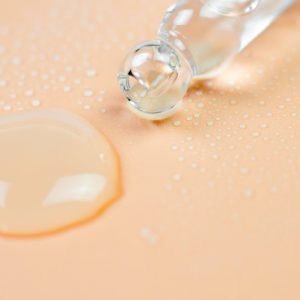 photo of human skin with drops of water on it