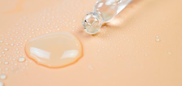 photo of human skin with drops of water on it