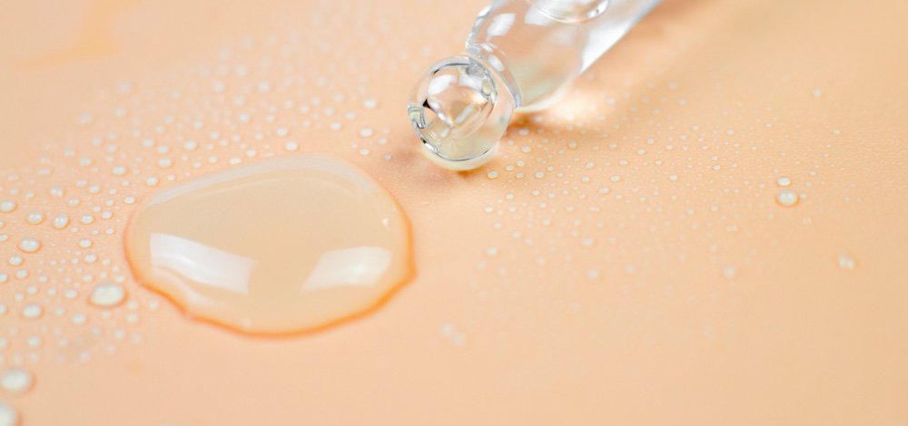 photo of human skin with drops of water on it