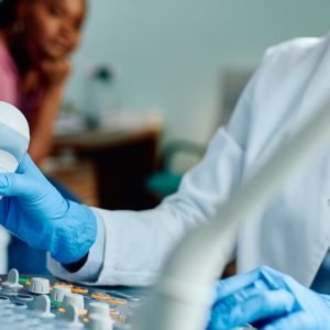 image of a doctor operating a diagnostic device